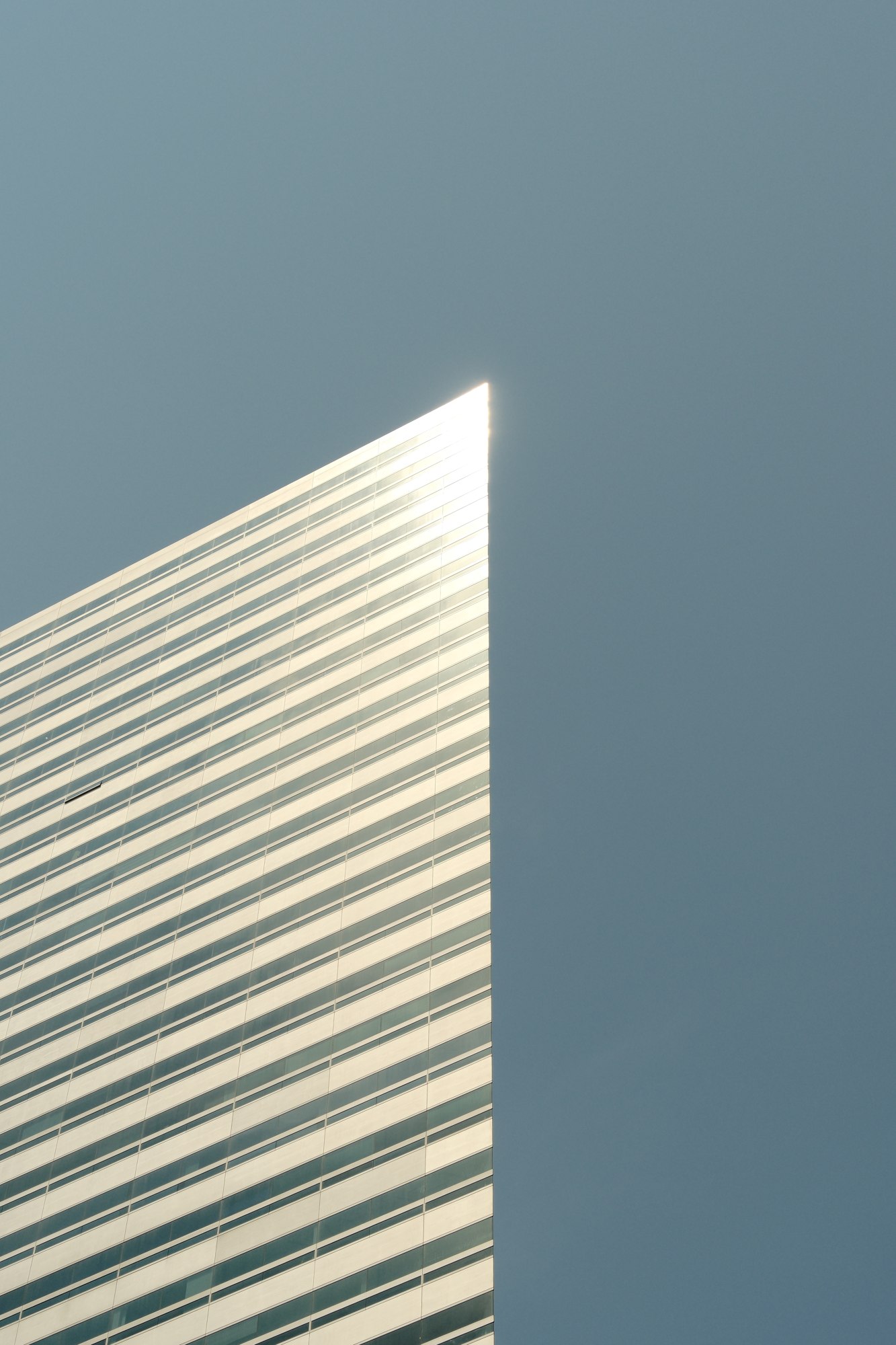 A white building against a blue sky