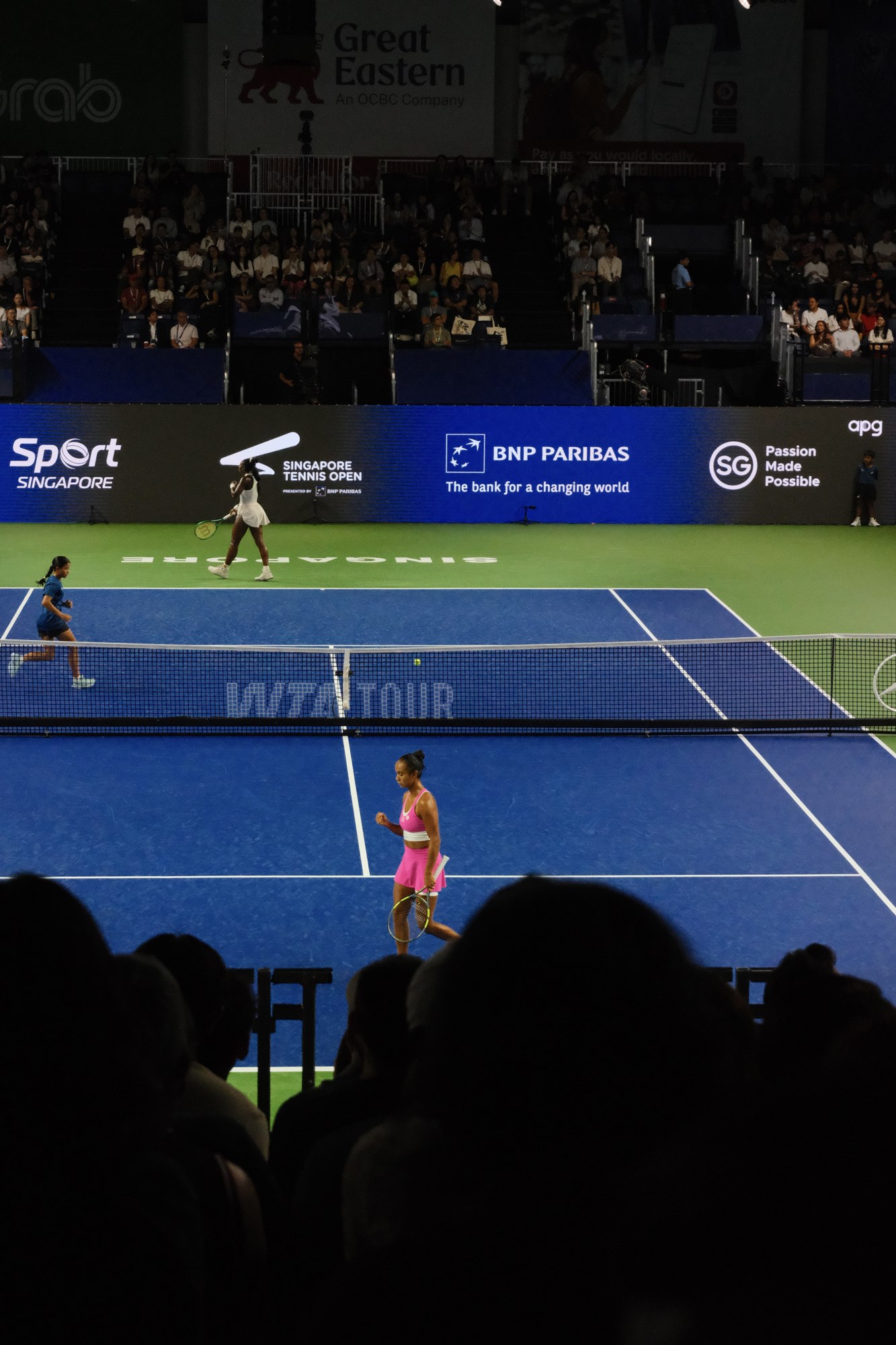 A tennis match viewed from the stands